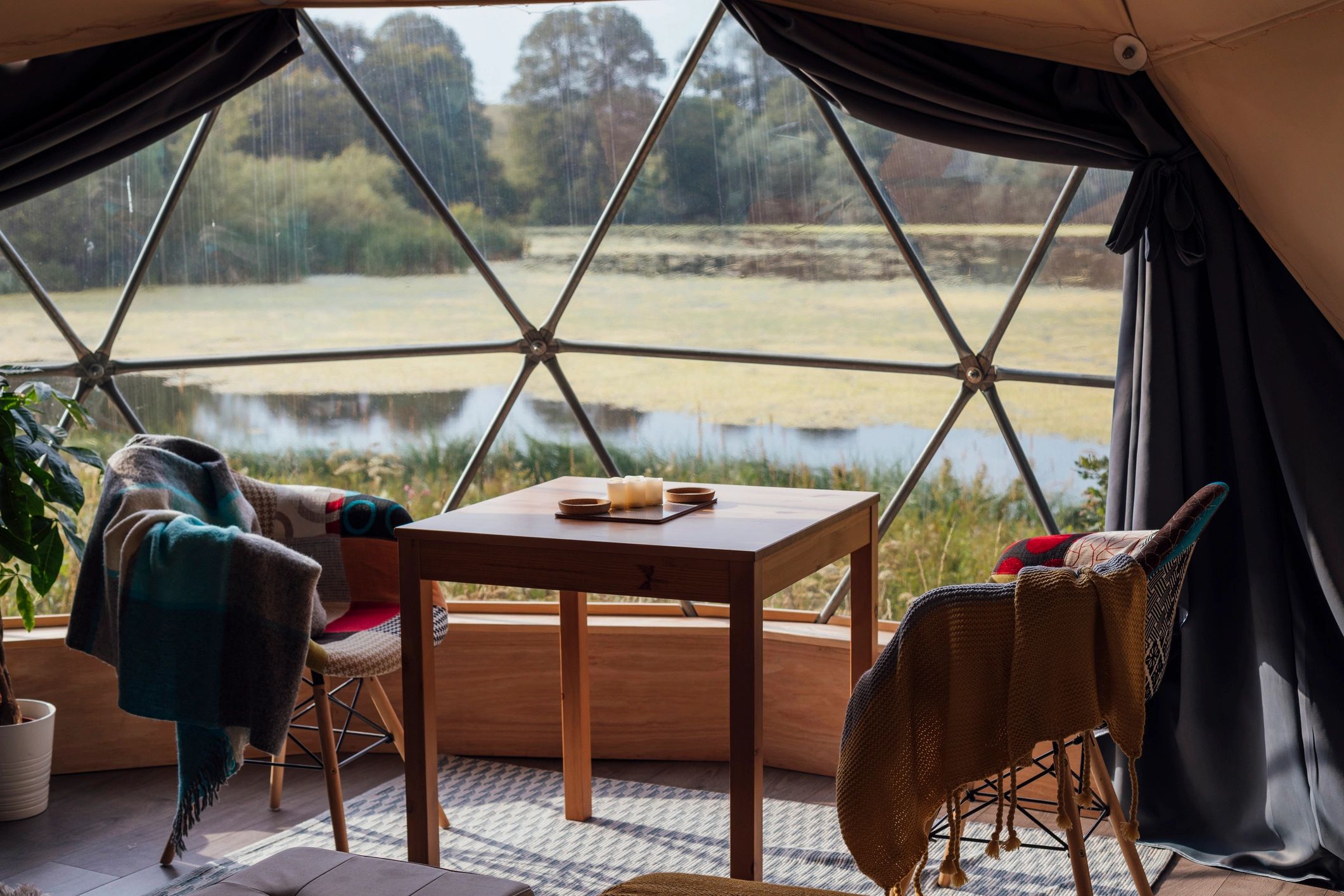 Luxury glamping dome in forest setting